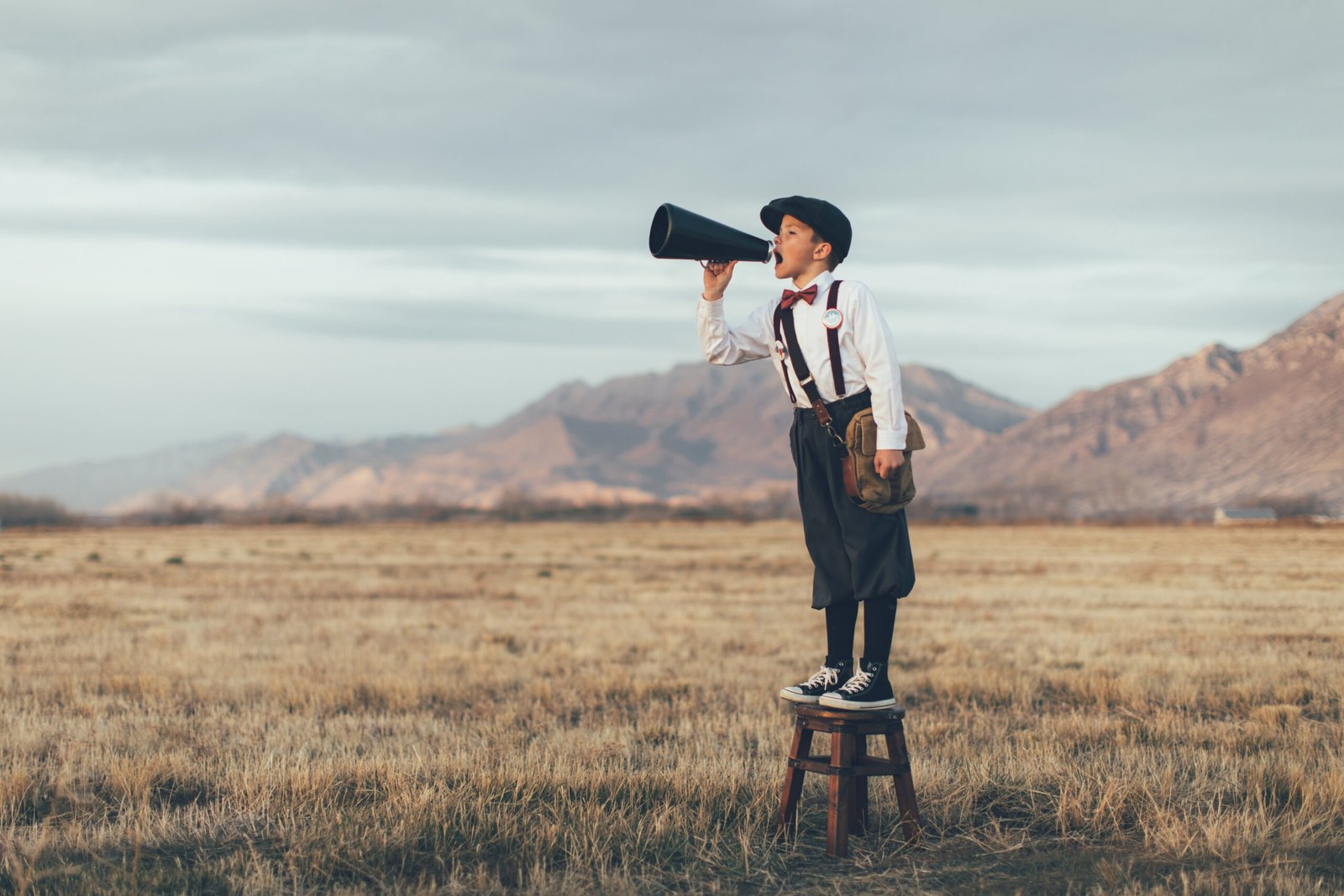 Old Fashioned News Boy Yelling Through Megaphone